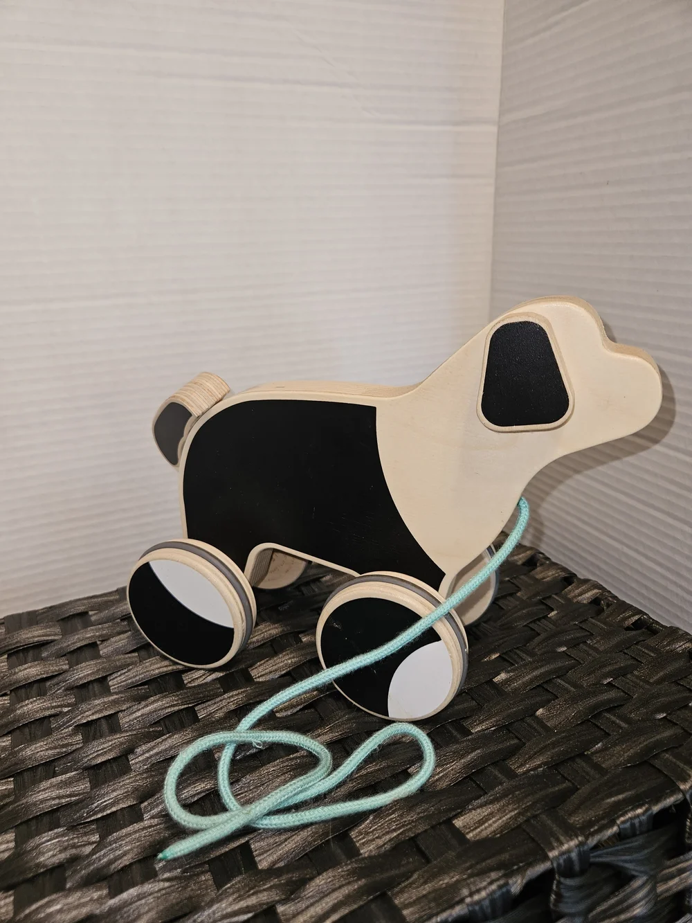 Natural Wood Pull-Along Puppy Toy with Black Panels and Mint Cord